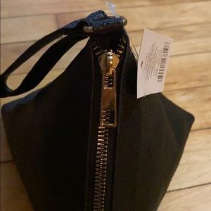 Small, Black, Triangle shaped Handbag.